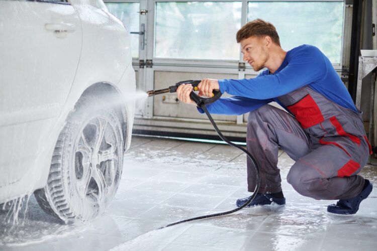 man-worker-washing-luxury-car-on-a-car-wash-e1626922938435-750x500